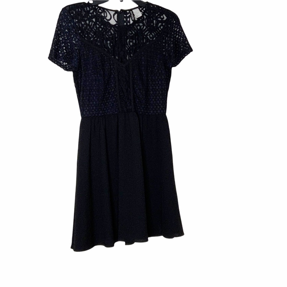 Divided black dress with lace details. Size 8 Kids